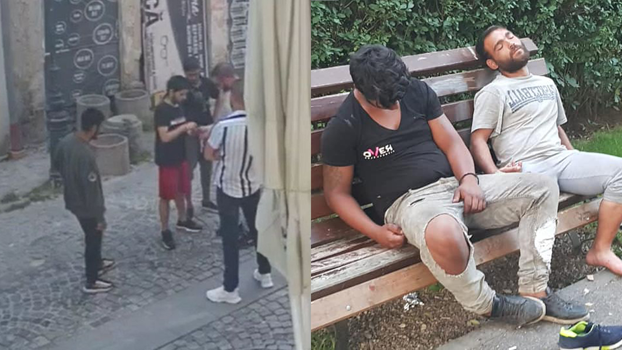 Persoane pe stradă și pe o bancă, unele părând adormite sau drogate
