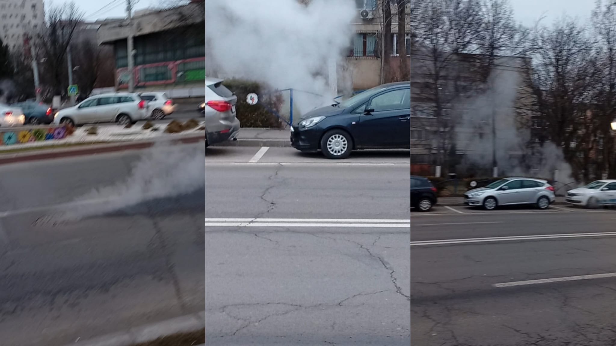 Emisie densă de abur ieșind din infrastructura stradală într-o zonă urbană aglomerată, lângă parcări și clădiri rezidențiale.